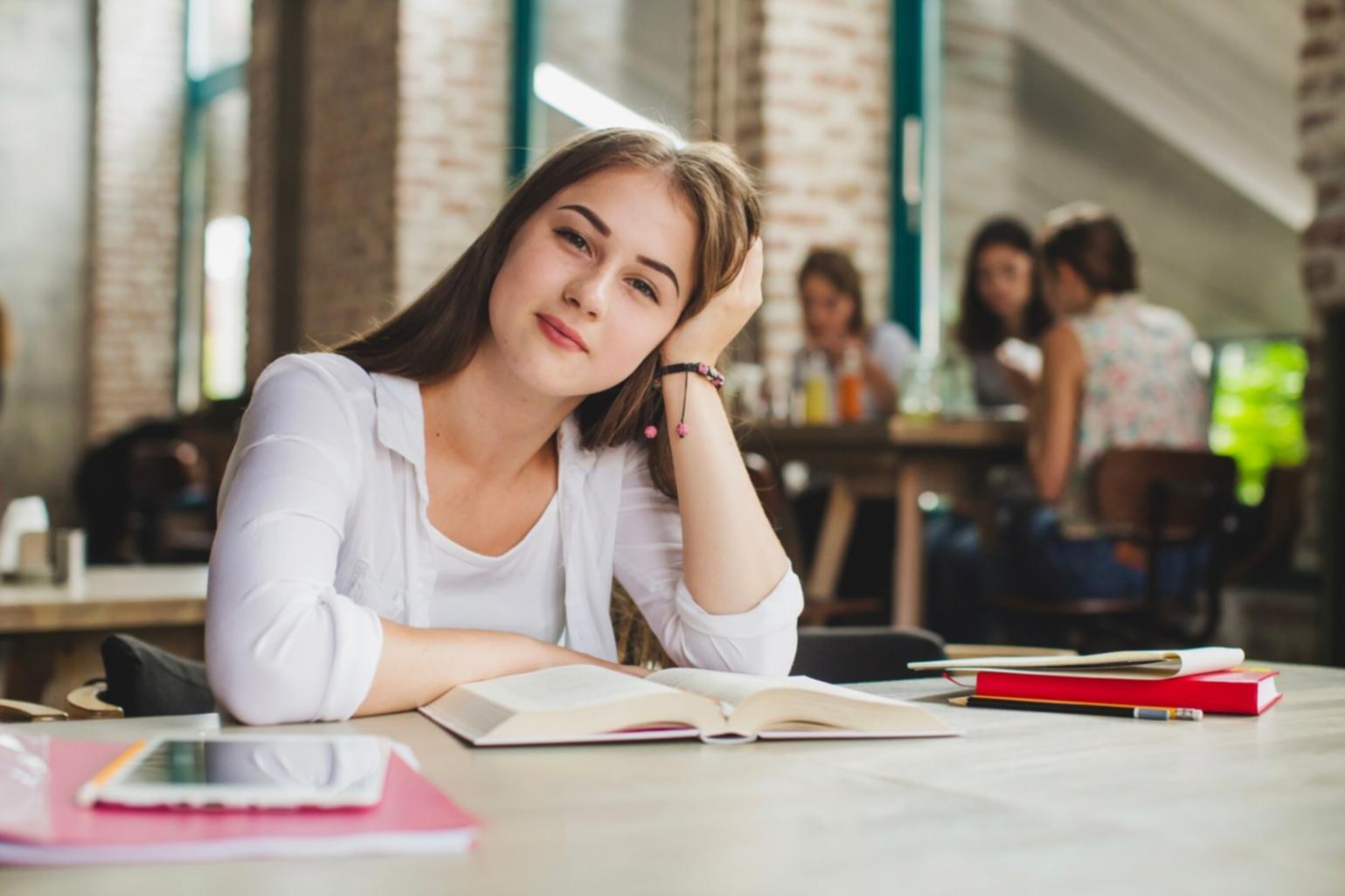 Instructor demonstrating profitability analysis on whiteboard