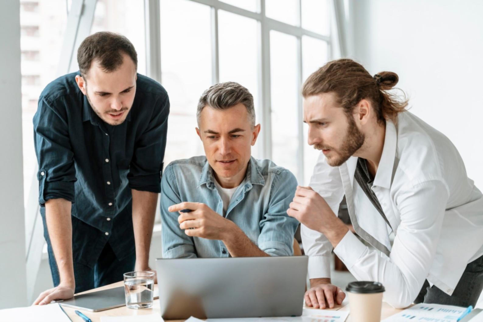 Professional collaboration workspace with financial documents and analysis materials